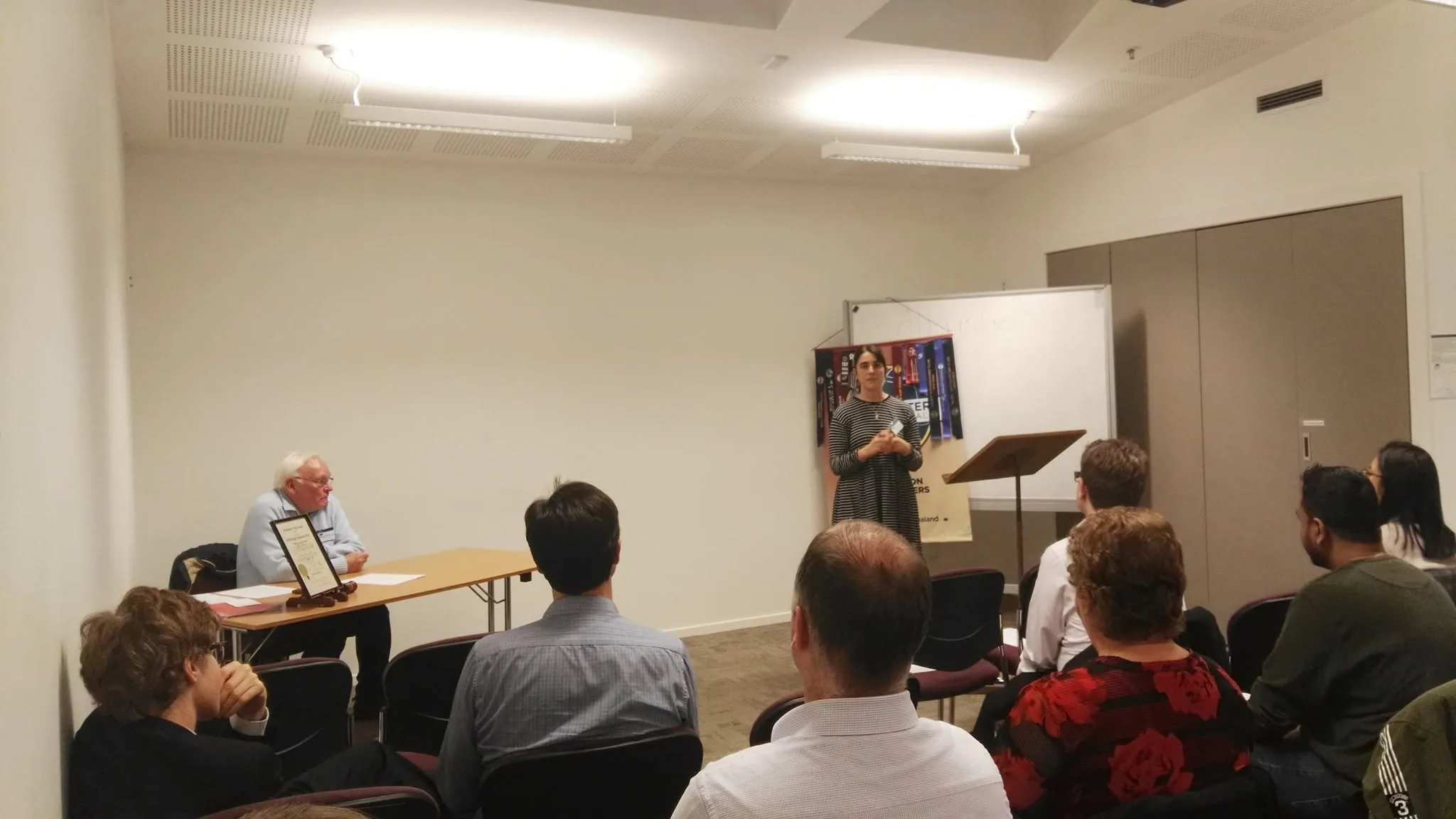 A Wellington Toastmasters member speaking to a seated audience